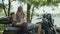 Relaxed couple talk on motorcycle during roadtrip