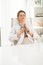 Relaxed female doctor sitting at a desk in the office