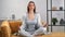 Relaxed female in lotus position enjoying meditation harmony balance. Shot with RED camera in 4K