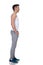 Relaxed fitness man waiting in line with hands in pockets