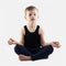 Relaxed funny child practicing yoga. little Boy does yoga