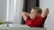 Relaxed happy school boy resting and smiling, healthy lazy calm rest, dreaming on a chair with book