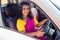 Relaxed indian woman in a traditional pink sari and costume jewelry on summer travel vacation to the coast towards the