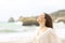 Relaxed lady breathing fresh air on the beach