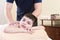 Relaxed little boy on reception at the chiropractor. Wellness massage procedure