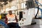 Relaxed machine operator reading newspaper