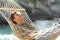 Relaxed man sleeping on a hammock on vacation