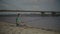 Relaxed man with spinning rod fishing on river