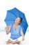 Relaxed Mature woman blue umbrella beach