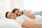 Relaxed Multiethnic Lovers Embracing On Bed