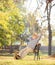 Relaxed pensioner sitting on a bench in park