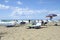 Relaxed people on the Sabaudia beach for the summer holidays. The Circeo Mountain on the background. Sabaudia, Lazio, Italy