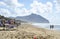 Relaxed people on the Sabaudia beach for the summer holidays. The Circeo Mountain on the background. Sabaudia, Lazio, Italy