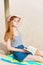 Relaxed Redhead Woman With Book On Beach