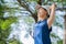 Relaxed runner stretching arms after exercise at park