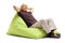 Relaxed senior sitting on a beanbag