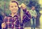 Relaxed teenage boy holding catch freshwater fish