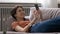 Relaxed teenage female lying on sofa hold smartphone check news