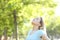 Relaxed teenage girl breathing fresh air in a park