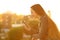 Relaxed woman in a balcony checking smart phone