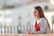 Relaxed woman contemplating views from a balcony