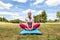 Relaxed woman doing yoga with upper body on exercise