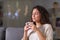 Relaxed woman smelling coffee cup in the night