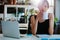 Relaxed young woman having coffee at her desk