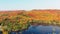 Relaxing aerial drone footage of a lake and mountains with the colors of Fall in the Laurentians