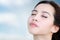 Relaxing asian woman with sky background