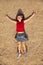 Relaxing cute little girl lying on the sand. child on vacation