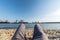 Relaxing on the Elbe beach in Hamburg with harbor and ships in the background