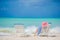 Relaxing and enjoying on summer vacation, woman lying on sunbed on beach