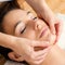 Relaxing facial massage on female chin.
