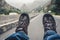 Relaxing feet with trekking footwear hanging from pickup car after long trek way. Santo Antao Island, Cape Verde