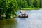 Relaxing gazebo built on the river against the forest