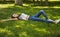 Relaxing girl lying on the grass.