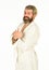 Relaxing at home. Man in terry bathrobe in the bathroom. Mature man wear bathrobe relaxing at spa. caucasian bearded guy