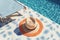 Relaxing poolside mockup with a sunhat