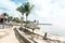 Relaxing scenery at resort in Guadeloupe. Tropical scene with beach chairs and palm trees