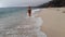 Relaxing summer holiday at the beach - cute girl at the ocean