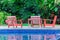 Relaxing Table set beside swimming pool.