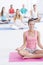 Relaxing yoga exercises at gym