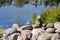 Relaxing, Zen Like View Including Stacks of Natural Rocks and a Lake during a Sunny Day