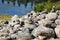 Relaxing, Zen Like View Including Stacks of Natural Rocks and a Lake during a Sunny Day