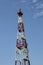 Relay mast on the background of a uniform blue sky