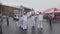 Relay race Sochi Olympic flame in Saint Petersburg. Torchbearers in uniform transfer fire. Volunteer