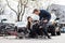 Reliable young man helping an injured woman while waiting for the ambulance