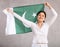 Reliant positive young woman holds big national flag of Pakistan with confident smile showing teeth