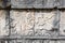 Relief carving of a Mayan holding a decapitated head at platform of eagles and jaguars, Chichen-Itza, Yucatan, Mexico